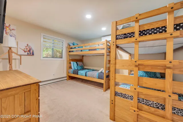 a view of a livingroom with furniture and a window