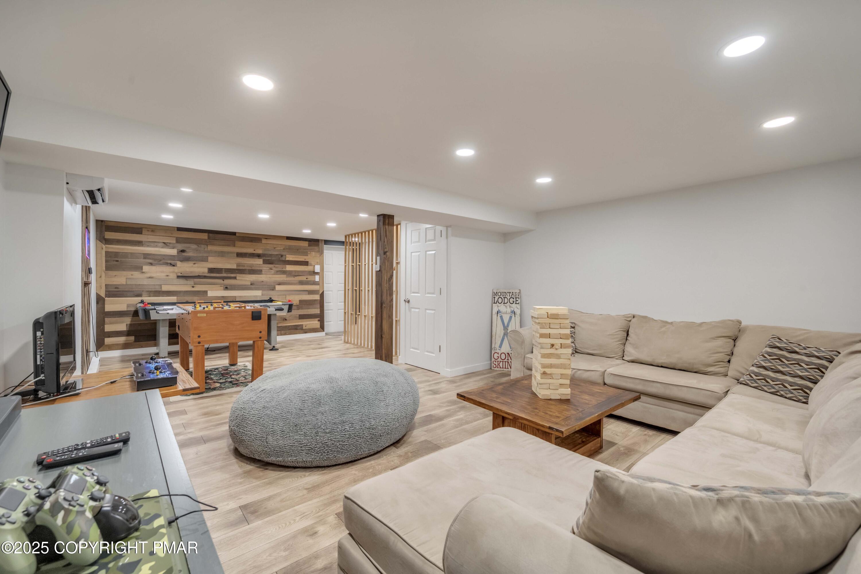 147 Cross Country Lane Tannersville, PA 18372 - Photo 30 of 39 a living room with furniture and a flat screen tv