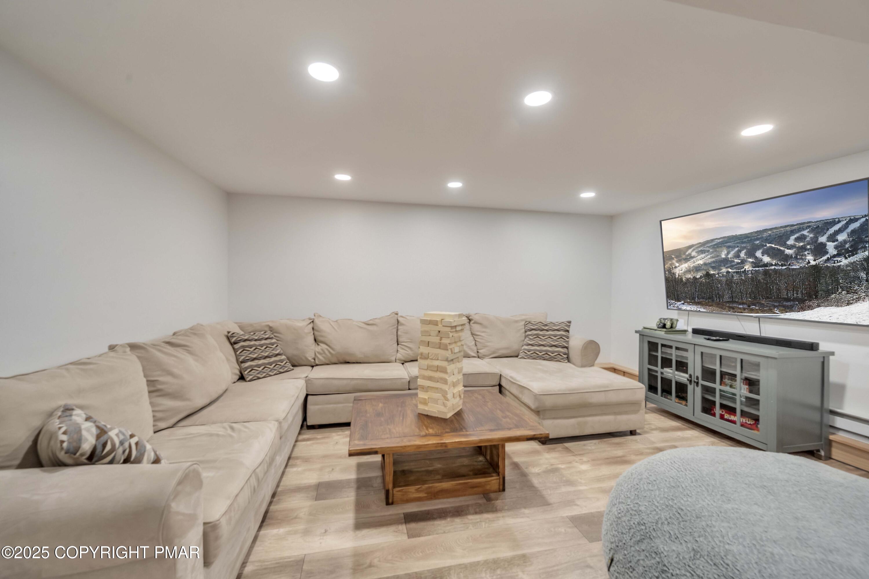 147 Cross Country Lane Tannersville, PA 18372 - Photo 32 of 39 a living room with furniture and a flat screen tv