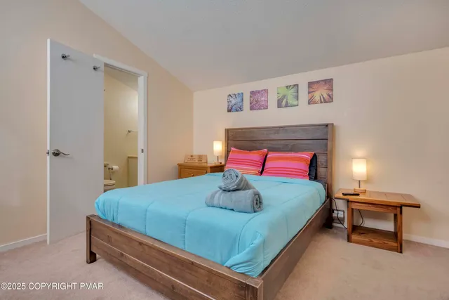 a bedroom with a bed and a dresser