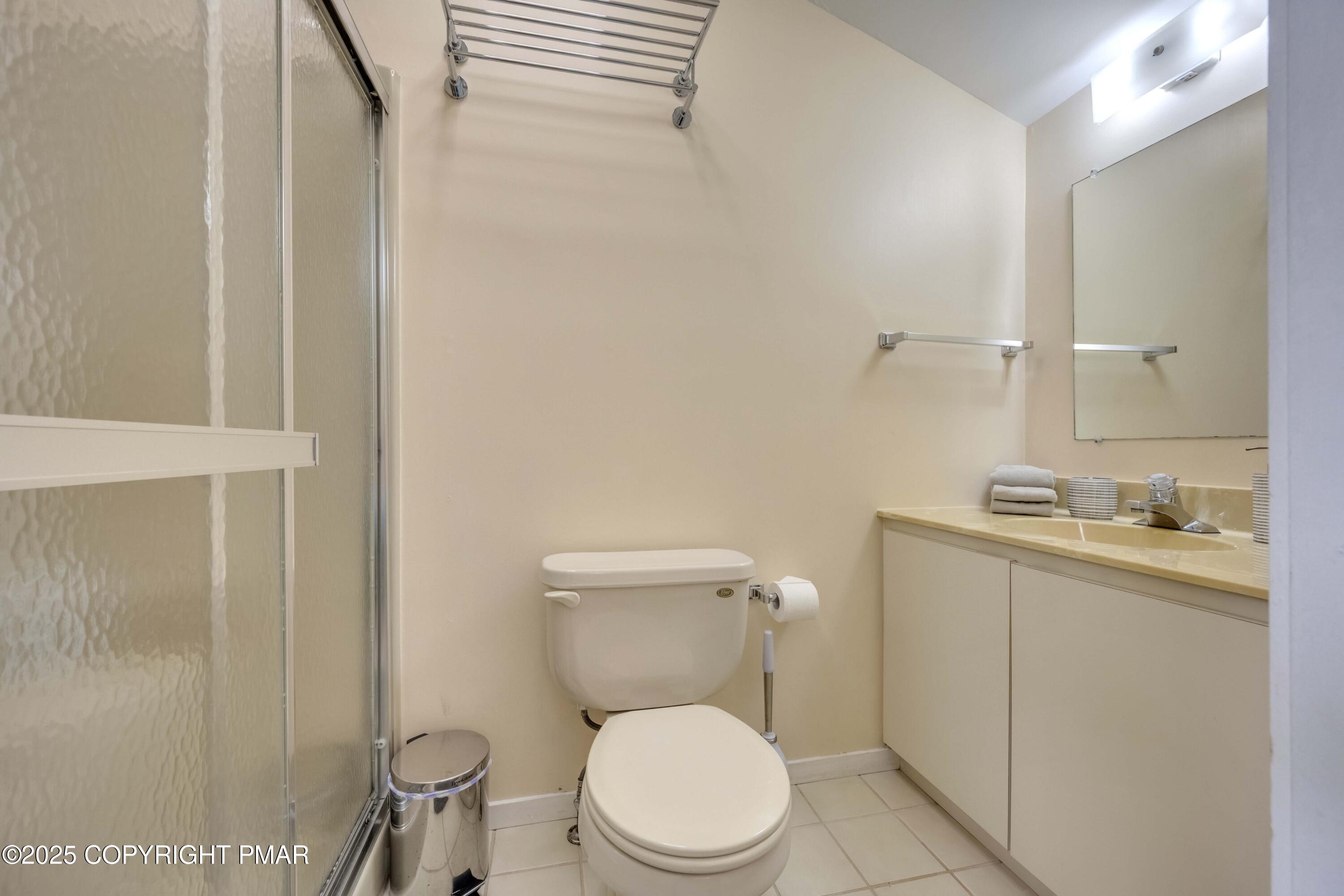 147 Cross Country Lane Tannersville, PA 18372 - Photo 37 of 39 a white toilet sitting next to a bathroom sink