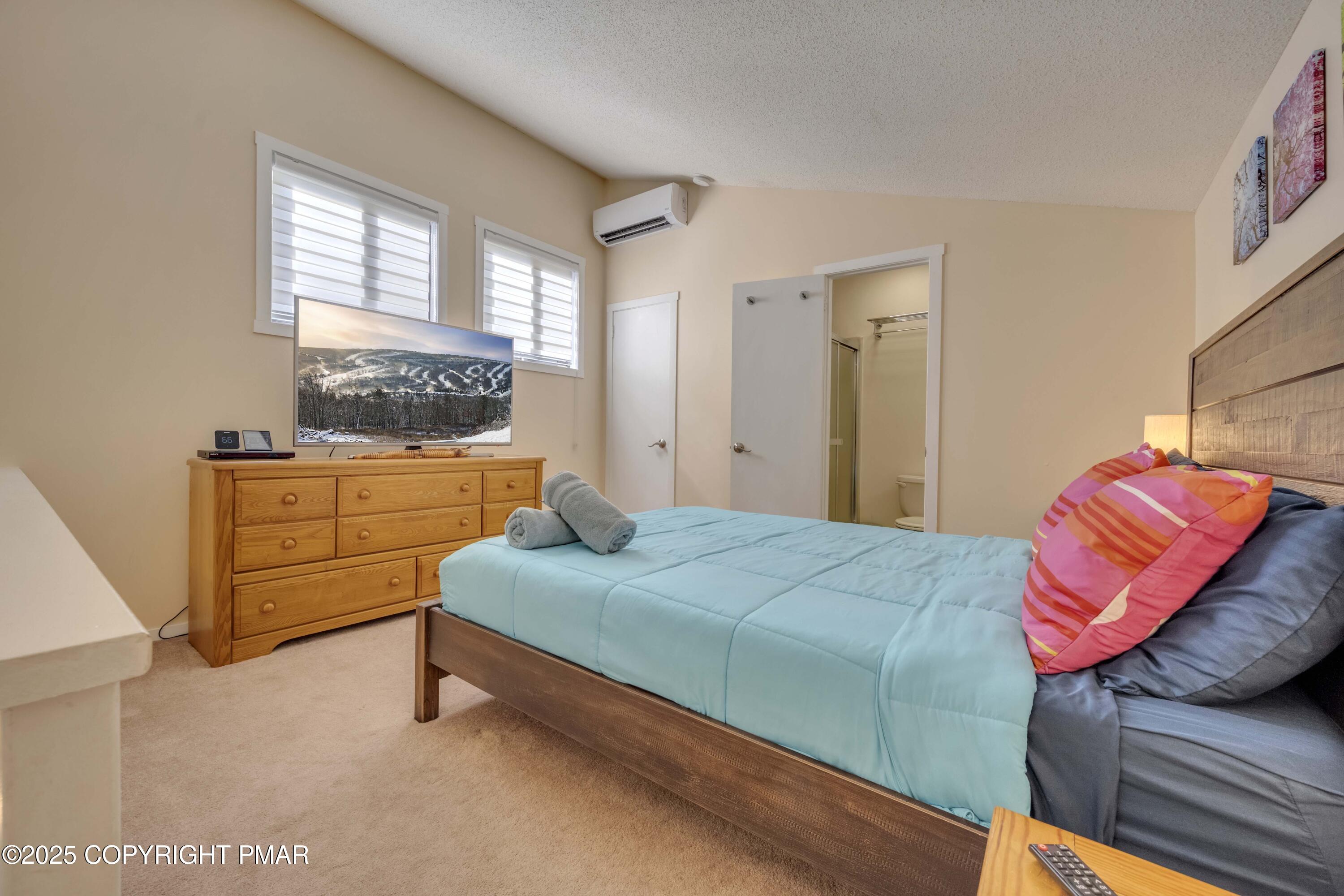 147 Cross Country Lane Tannersville, PA 18372 - Photo 39 of 39 a bedroom with a bed and wooden floor