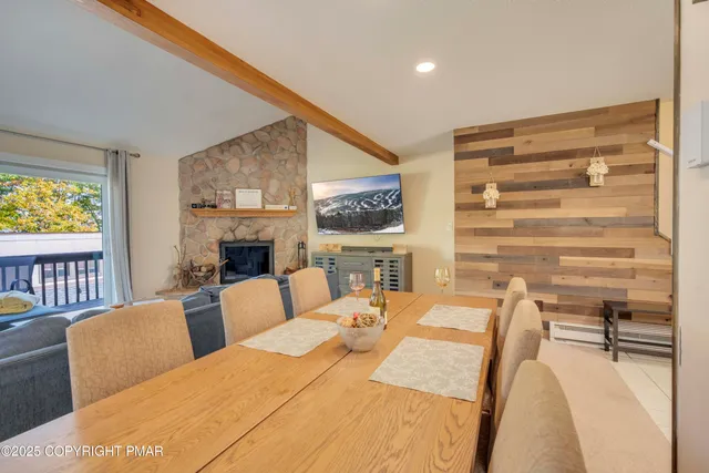 a bedroom with furniture and a fireplace