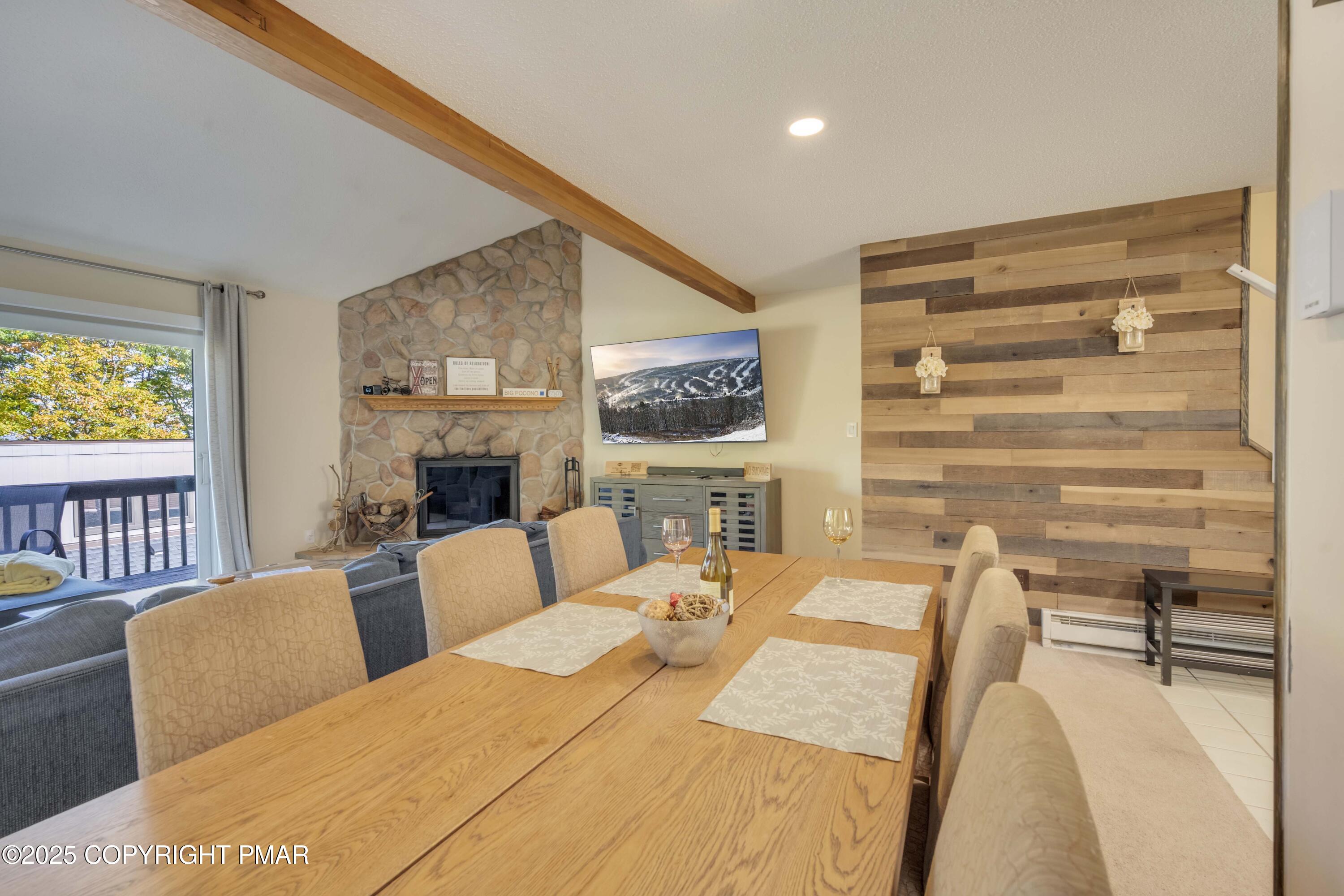 147 Cross Country Lane Tannersville, PA 18372 - Photo 8 of 39 a bedroom with furniture and a fireplace