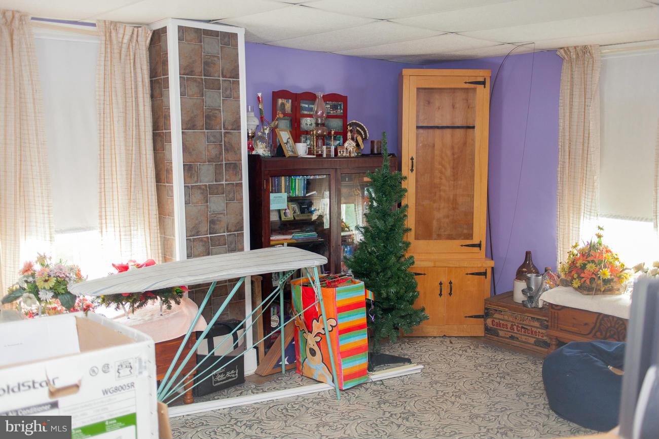 13020 Good Intent Road Union Bridge, MD 21791 - Photo 11 of 15 a view of living room filled with furniture and toys