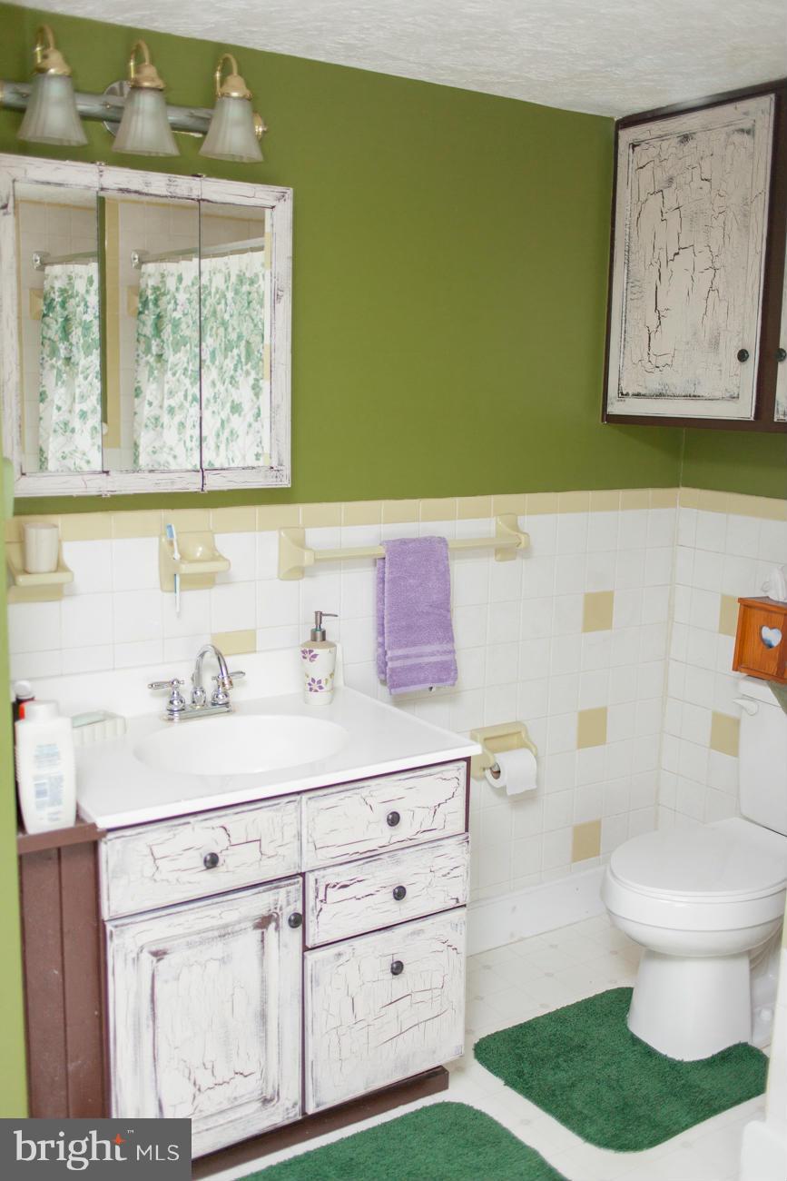 13020 Good Intent Road Union Bridge, MD 21791 - Photo 13 of 15 a bathroom with a sink a toilet and a mirror