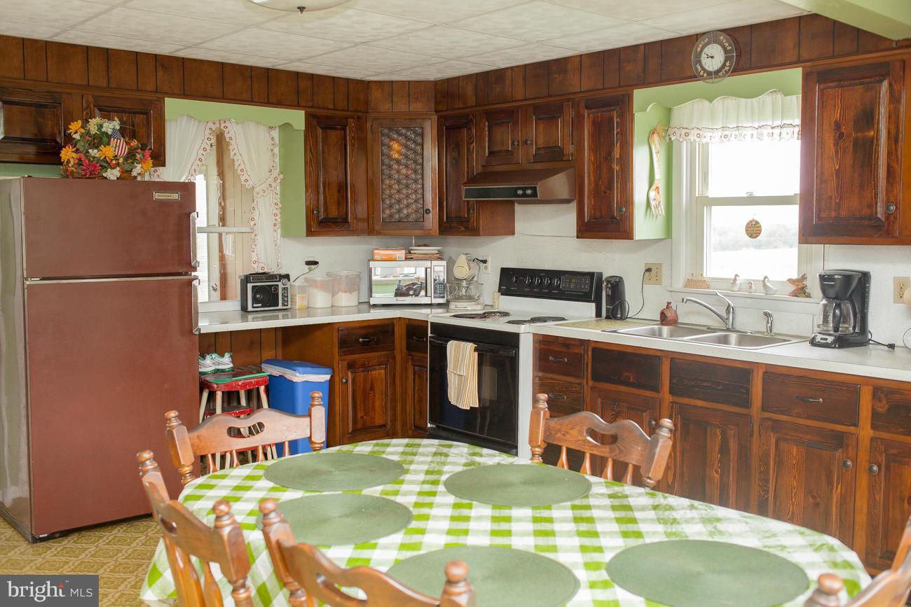 13020 Good Intent Road Union Bridge, MD 21791 - Photo 5 of 15 a kitchen with stainless steel appliances granite countertop a sink stove and refrigerator