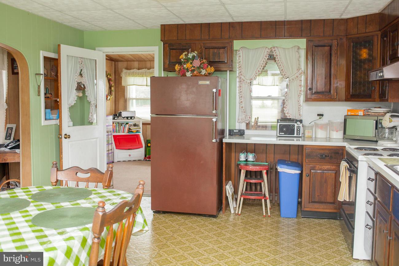13020 Good Intent Road Union Bridge, MD 21791 - Photo 6 of 15 a kitchen with stainless steel appliances granite countertop a refrigerator and a stove