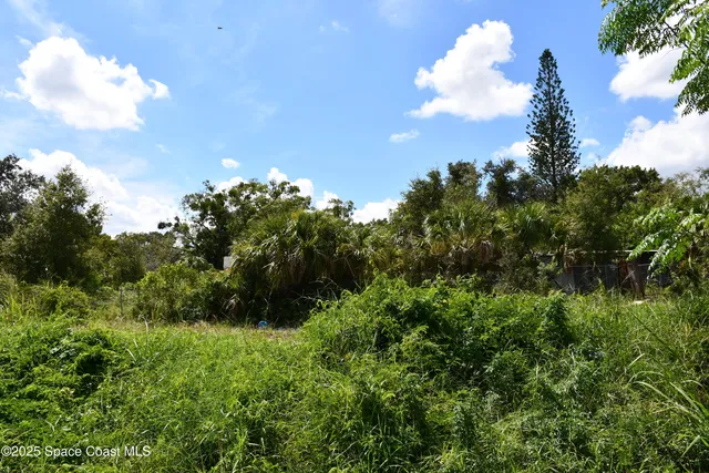 a view of a lake view with houses in back