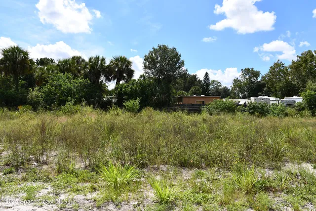 a view of a street with cars