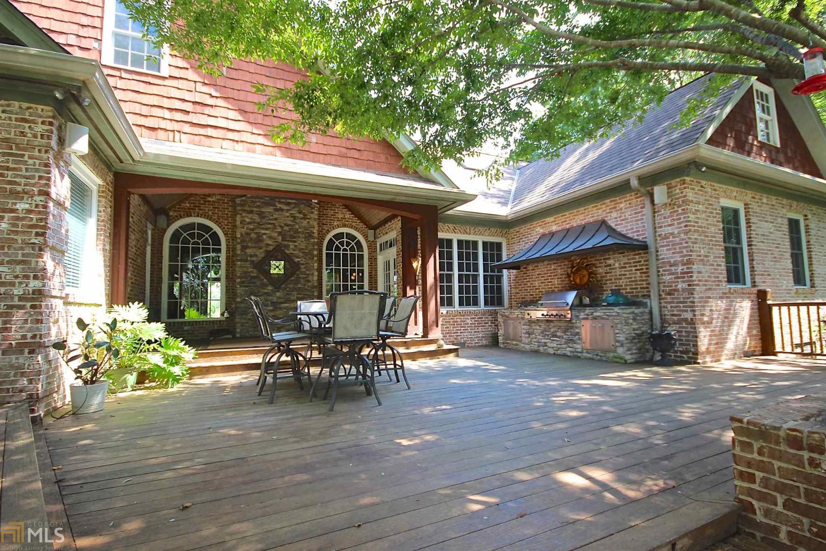 a view of a house with sitting area and garden