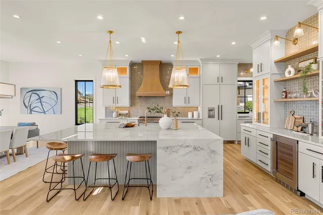 a kitchen with a sink appliances and cabinets