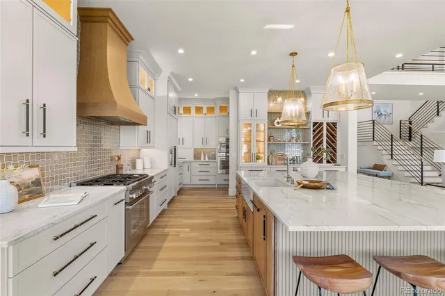a kitchen with a sink and a stove