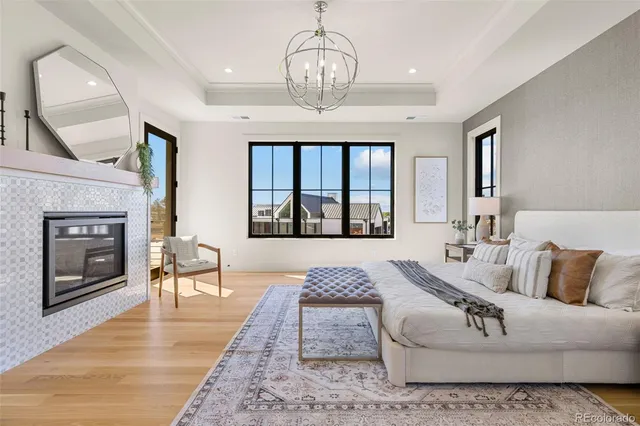 a bedroom with a bed and a fireplace