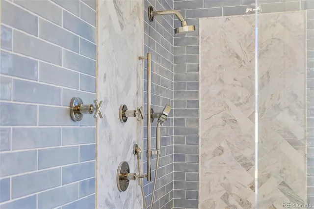 a bathroom with a granite countertop sink a vanity and a mirror