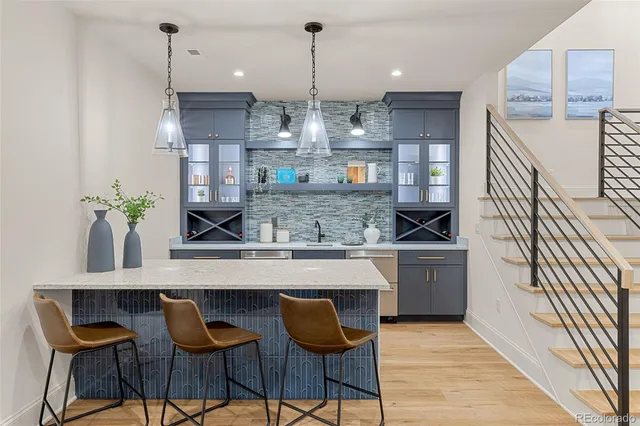 a living room with furniture and painting on the wall