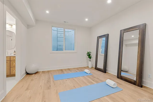 a front view of a house with a garden and yard