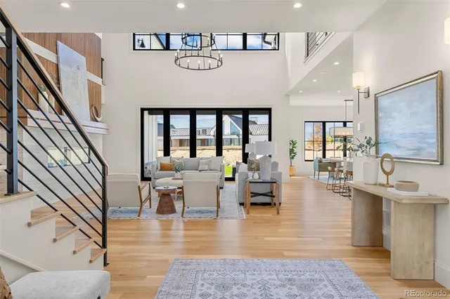 a living room with fireplace furniture and a wooden floor