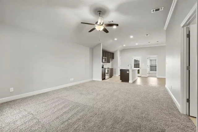 a view of a livingroom with a kitchen