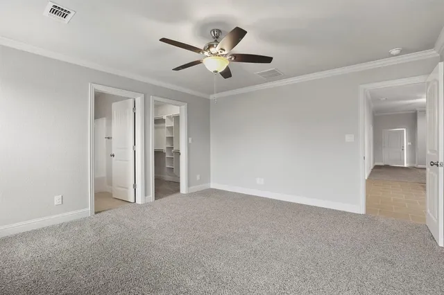 a view of a livingroom with a ceiling fan and window