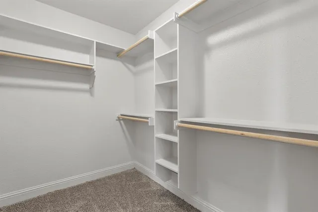 a view of an empty walk in closet
