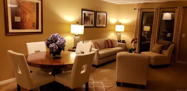 a living room with furniture and a table