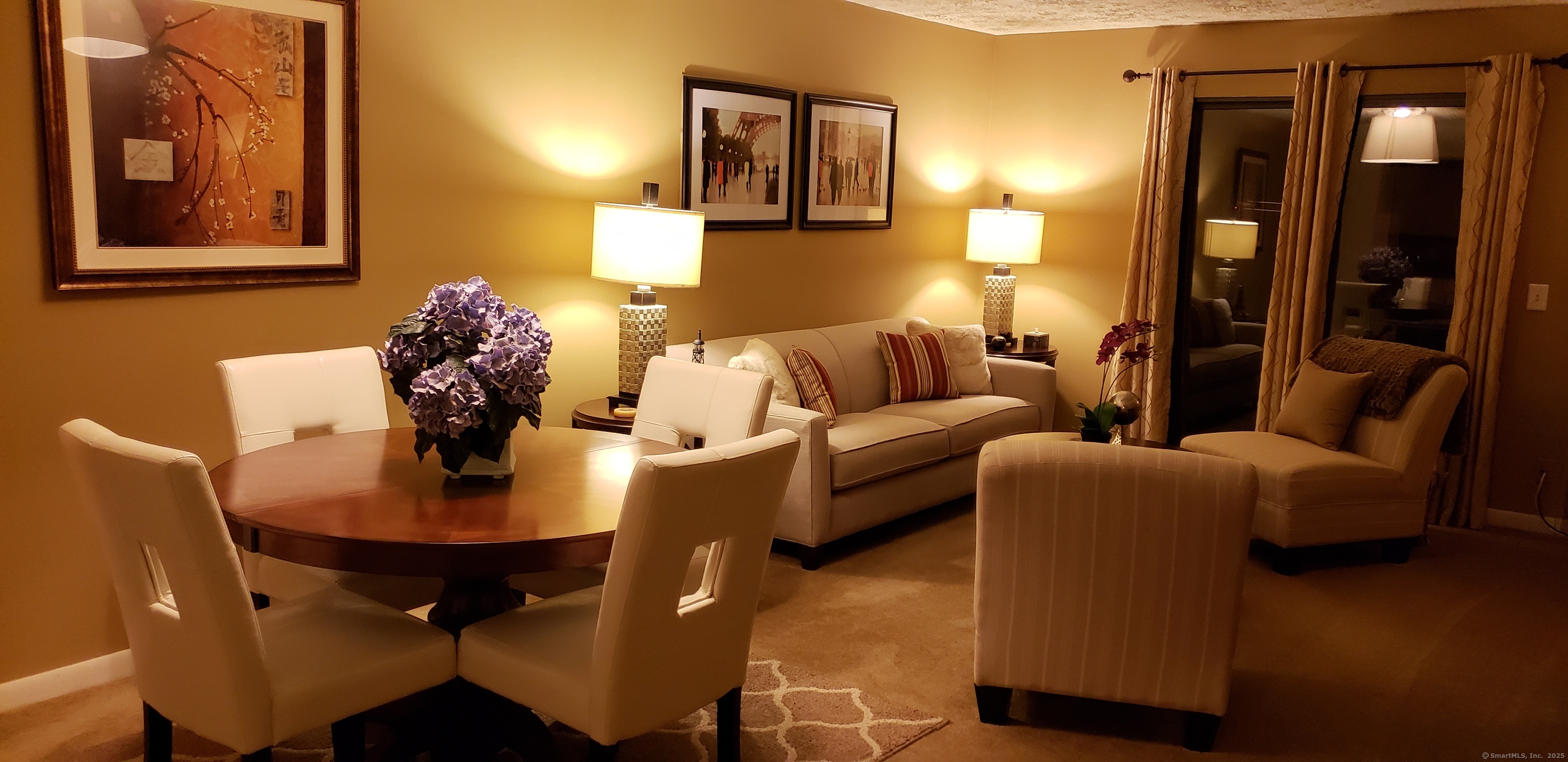 a living room with furniture and a table