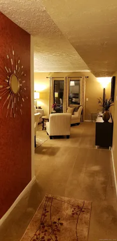 a view of living room with furniture and window