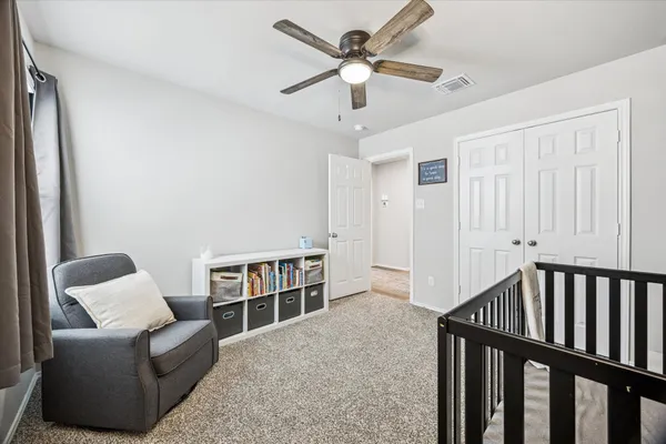 a view of walk in closet with clothes