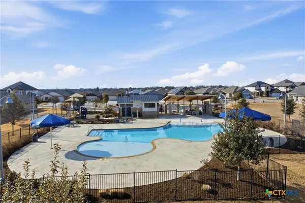 a house view with a sitting space and garden