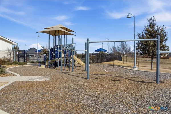 a view of a swimming pool and a chairs