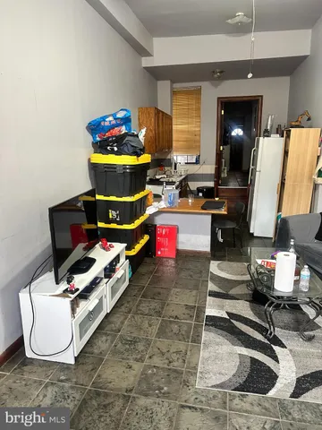 a room with furniture and gym equipment