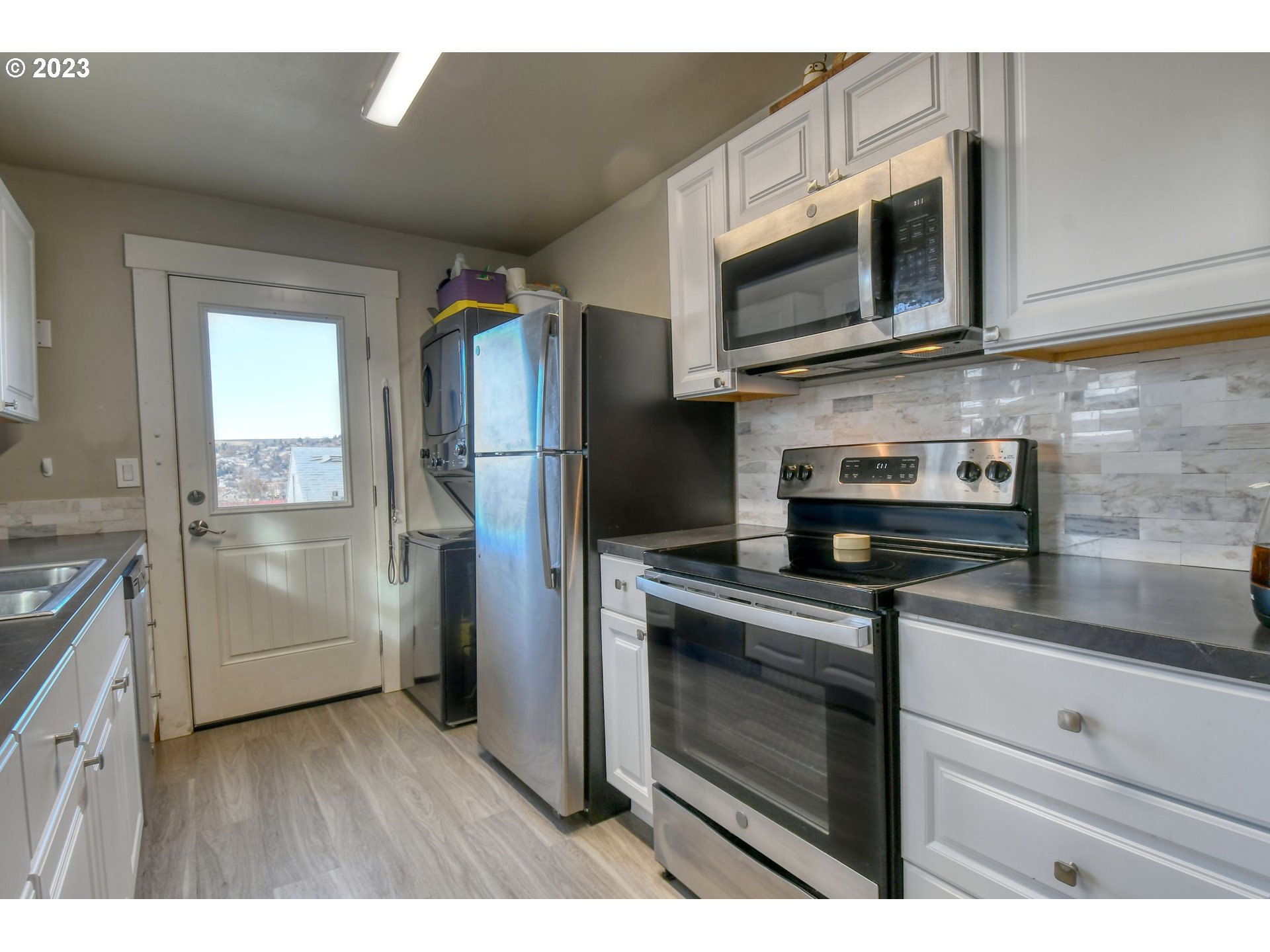 207 Southwest Isaac Avenue Pendleton, OR 97801 - Photo 17 of 32 a kitchen with stainless steel appliances granite countertop a refrigerator stove and microwave