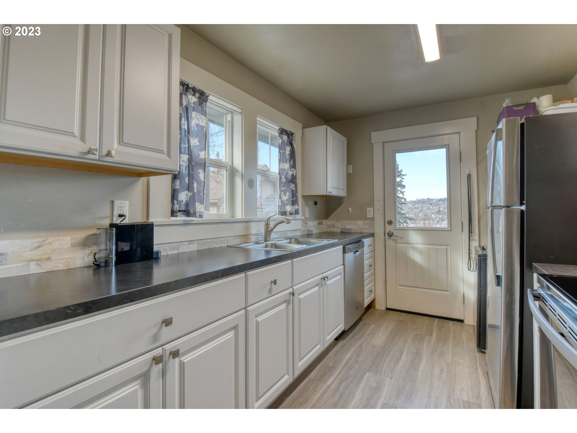 207 Southwest Isaac Avenue Pendleton, OR 97801 - Photo 19 of 32 a kitchen with cabinets and stainless steel appliances