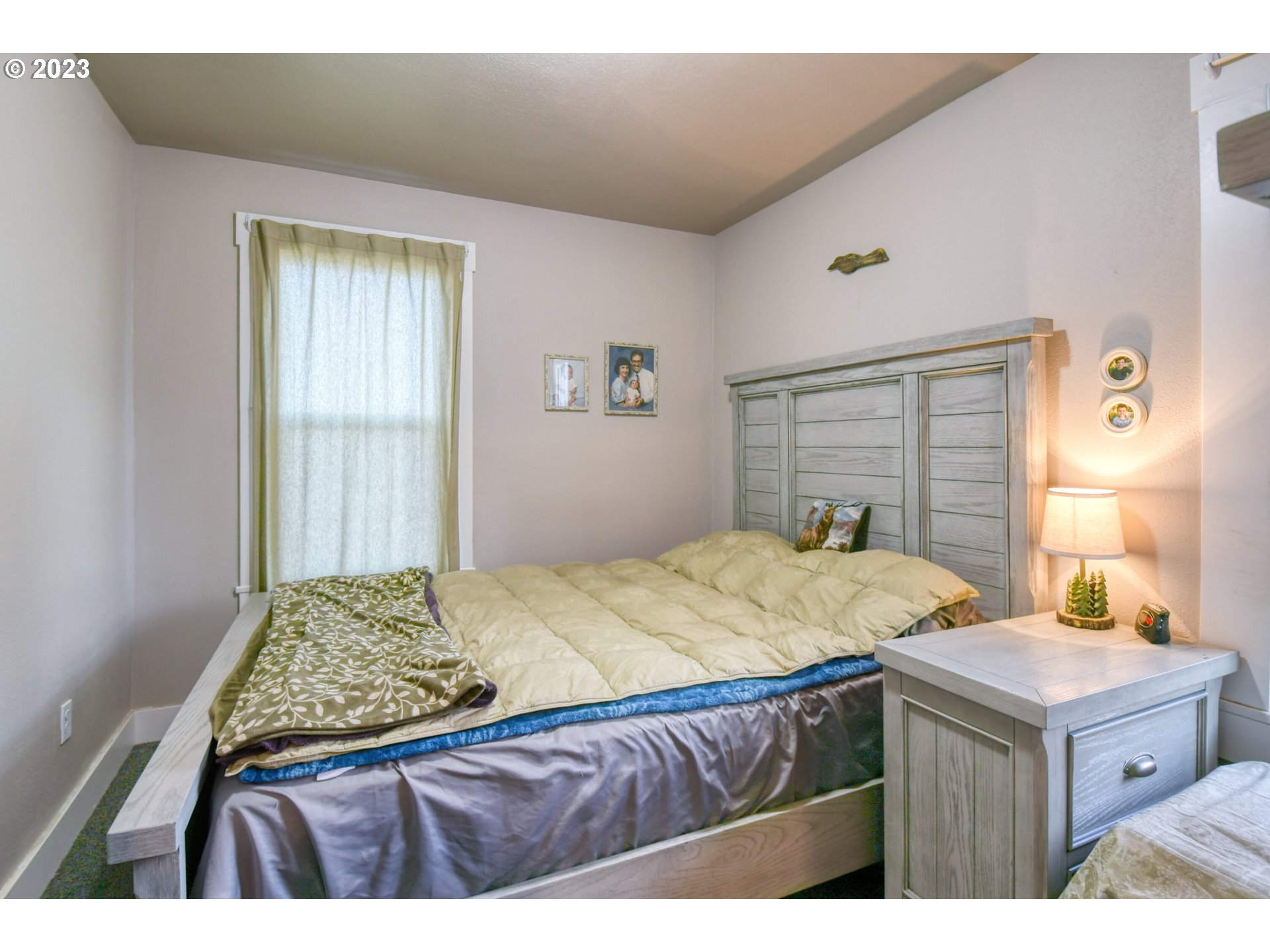 207 Southwest Isaac Avenue Pendleton, OR 97801 - Photo 22 of 32 a bedroom with a bed and a dresser