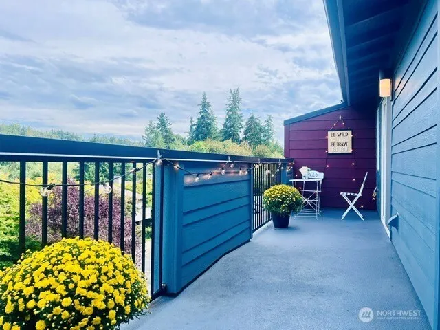 a backyard of a house with table and chairs