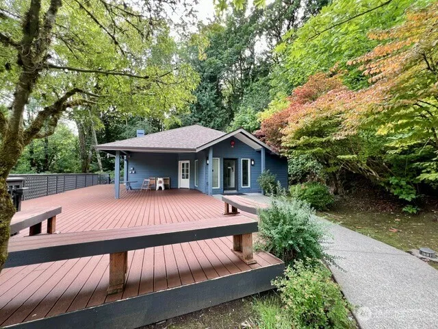 a view of house with outdoor seating area