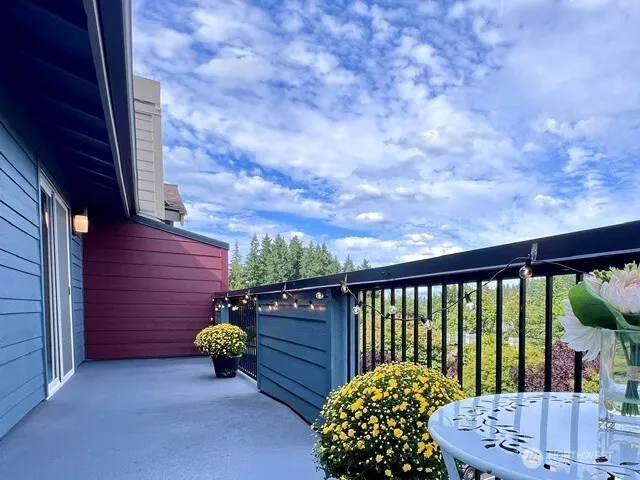 a balcony view with couple of chairs