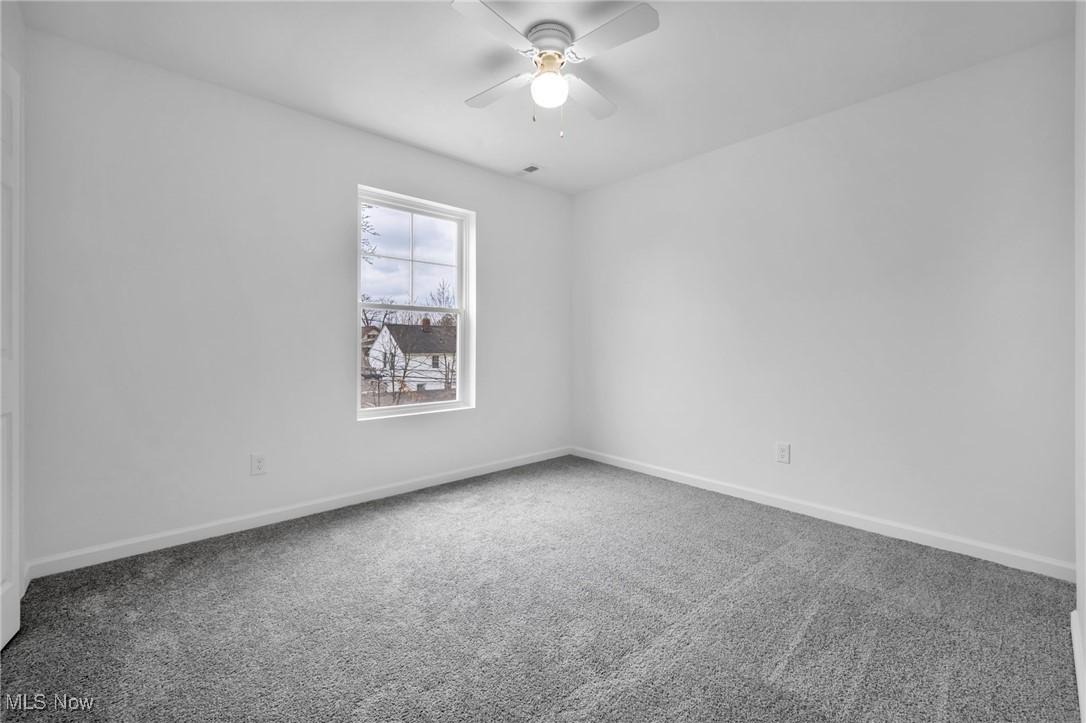 3734 Pennington Road Cleveland, OH 44120 - Photo 30 of 45 Empty room with carpet flooring and a ceiling fan
