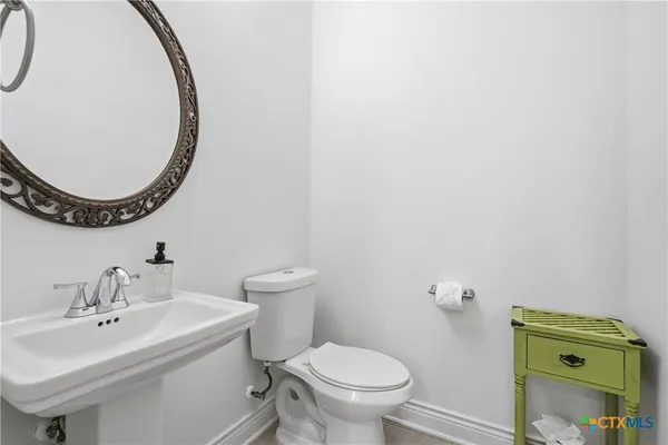 a bathroom with a toilet and a sink