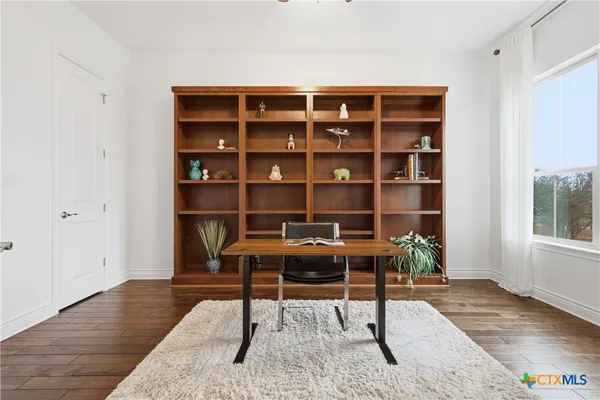 a view of a workspace with furniture