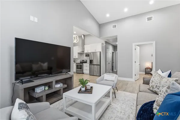 a living room with furniture and a window