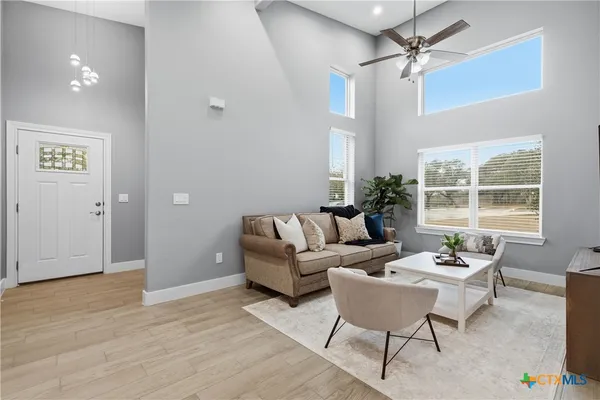 a kitchen with a refrigerator stove and white cabinets