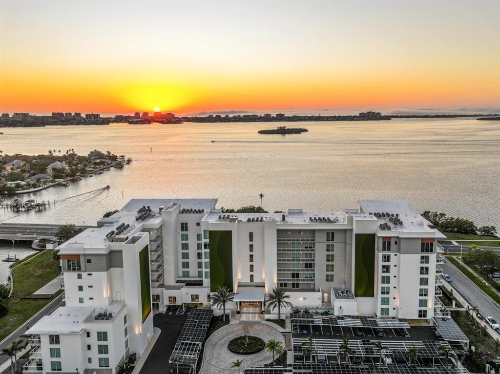 1020 Sunset Point Road, Unit 609 Clearwater, FL 33755 - Photo 2 of 20 a view of a lake with tall buildings