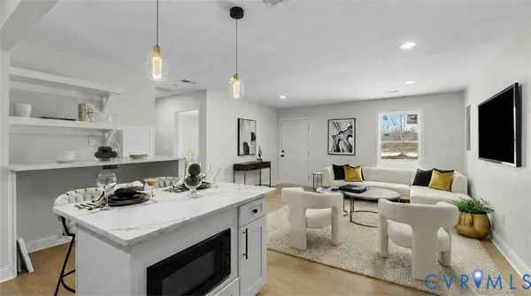 a bathroom with a sink toilet vanity and shower