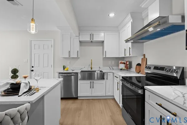 a bathroom with a sink a toilet and a bathtub