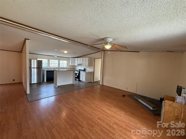 a view of a livingroom with wooden floor