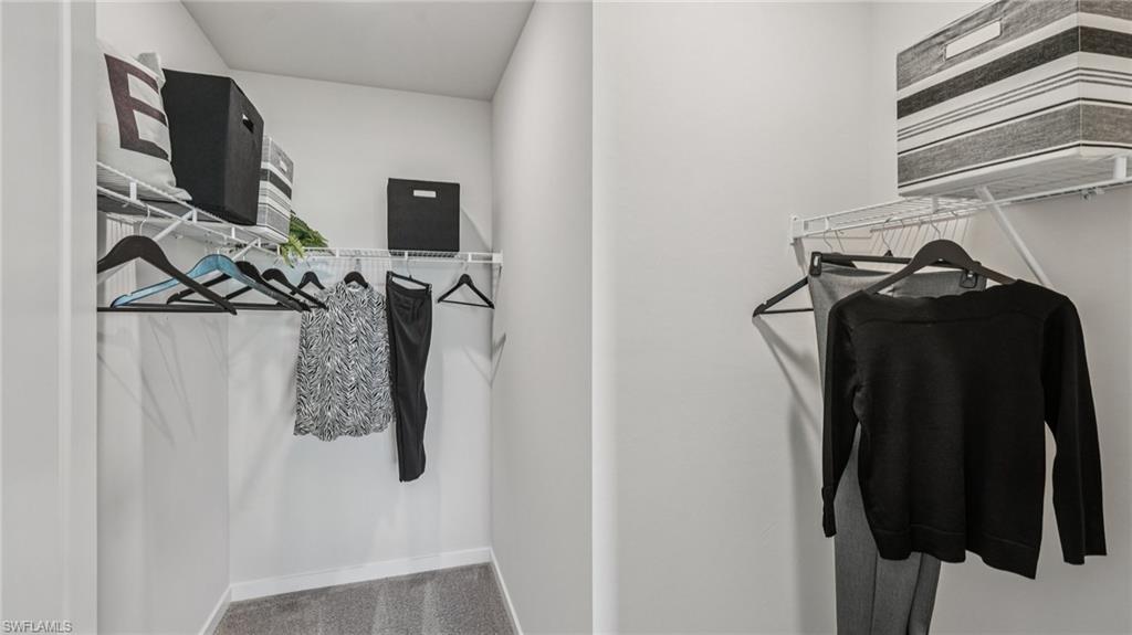 17584 Shade Tree Loop Punta Gorda, FL 33982 - Photo 17 of 35 Walk-in closet featuring wire shelving and hanging rods