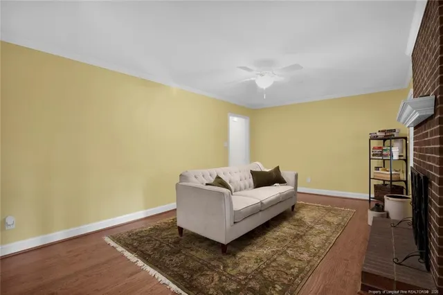 a living room with couch and a flat screen tv