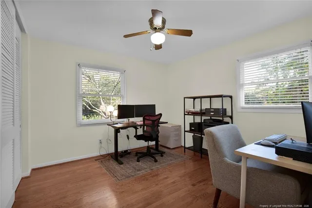 a work room with furniture and a window